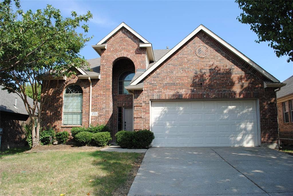 5108 Blackwood Drive, McKinney, TX 75071 Brick exterior with multiple gables, arched windows, and a two-car garage