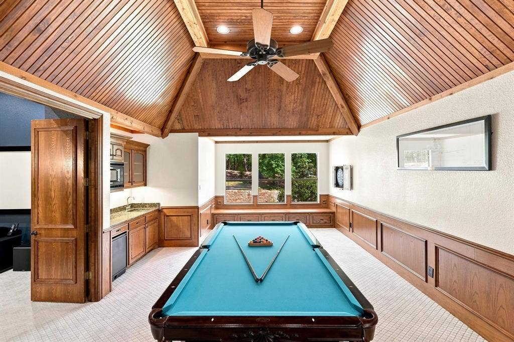 Vaulted wood-paneled ceiling with exposed beams