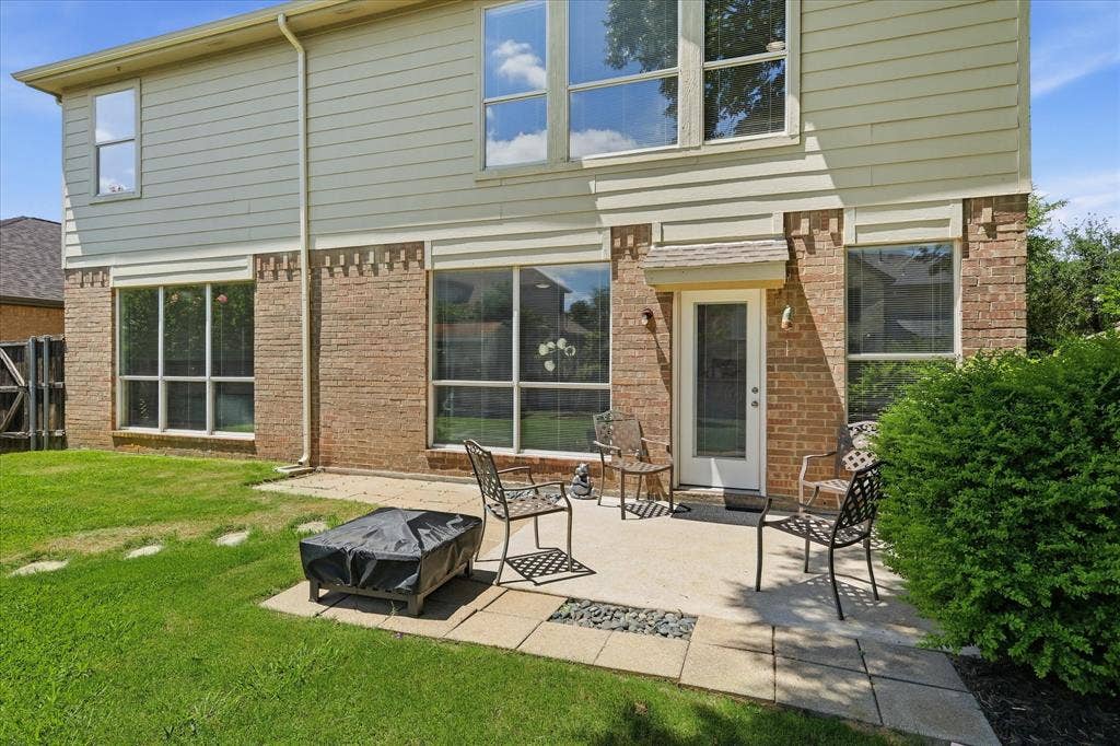 2112 Loon Lake Road, Denton, TX 76210 Brick and siding exterior with multiple large windows