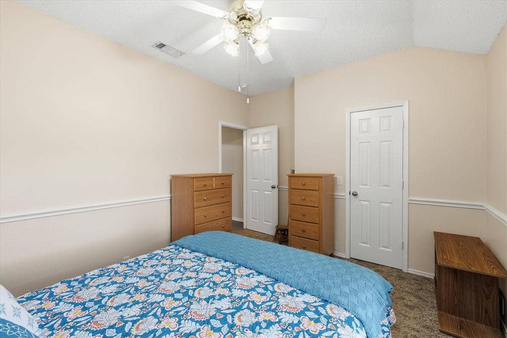 2112 Loon Lake Road, Denton, TX 76210 Vaulted ceiling with a ceiling fan, crown molding, and paneled interior doors