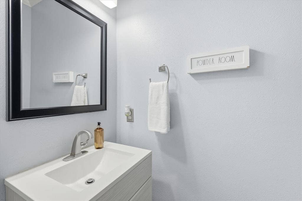 2112 Loon Lake Road, Denton, TX 76210 Integrated vanity with a single basin sink and brushed nickel faucet