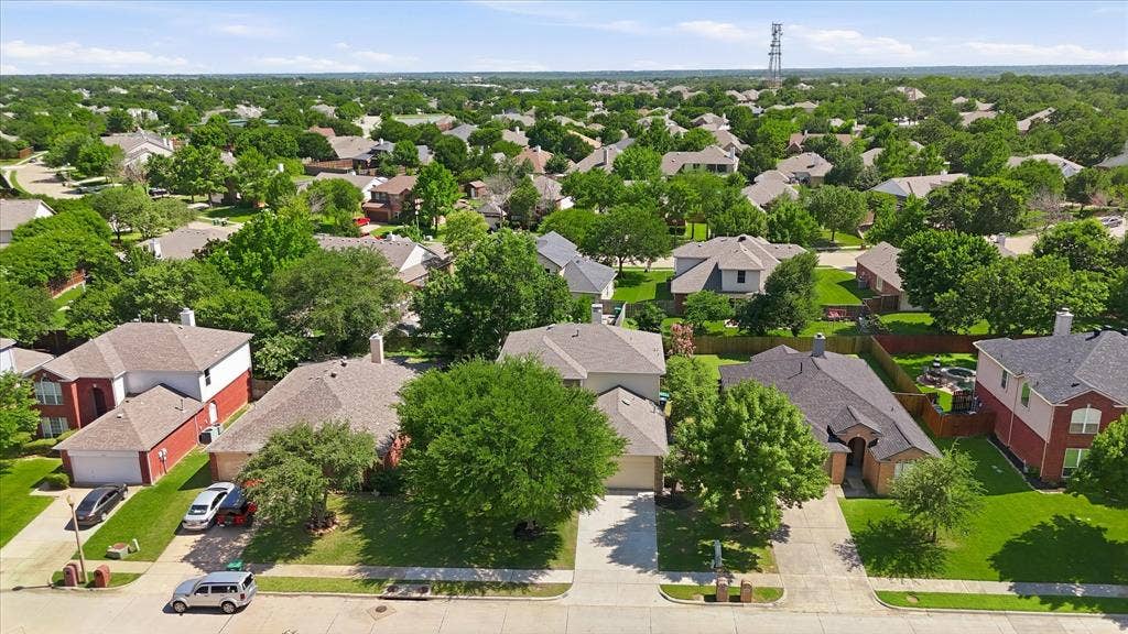 2112 Loon Lake Road, Denton, TX 76210 Residential neighborhood featuring a consistent roofline, mature trees, and well-maintained green spaces
