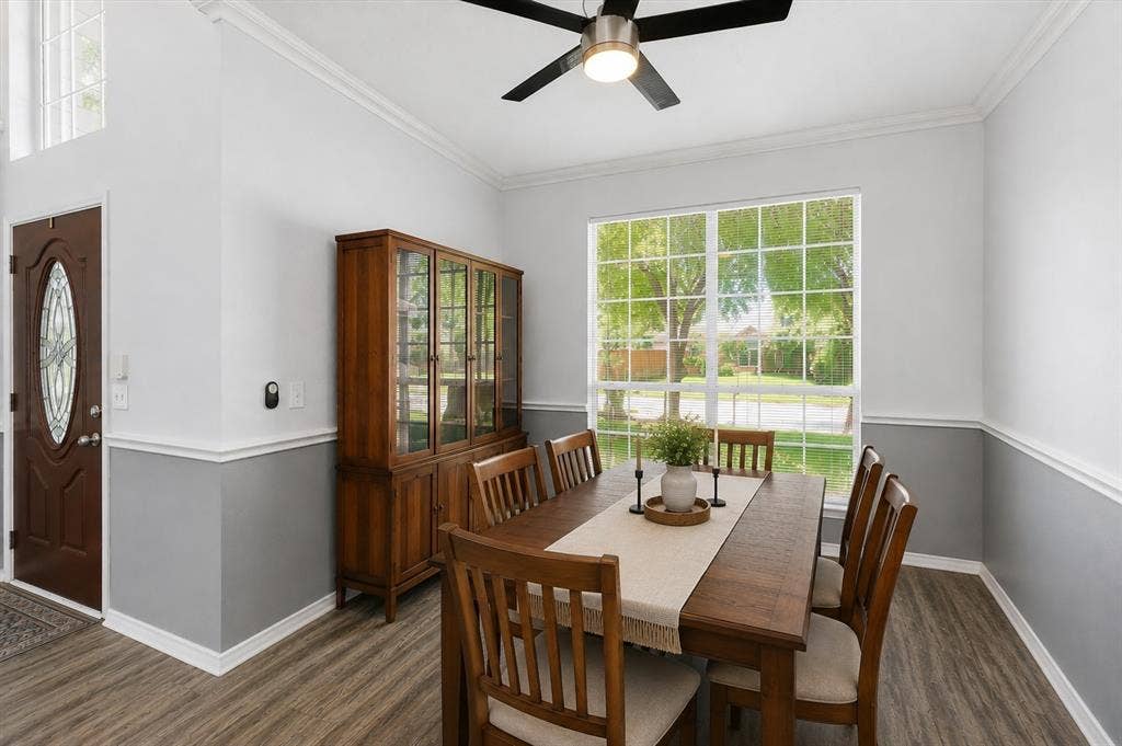 2112 Loon Lake Road, Denton, TX 76210 Wood-finish flooring, crown molding, and a decorative front door with an oval glass insert
