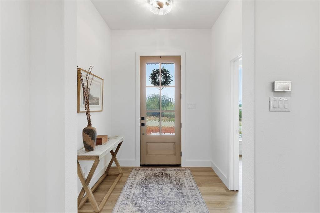 124 Norene Lane, Weatherford, TX 76088 Light wood-finish flooring, bright white walls, and a recessed ceiling light fixture