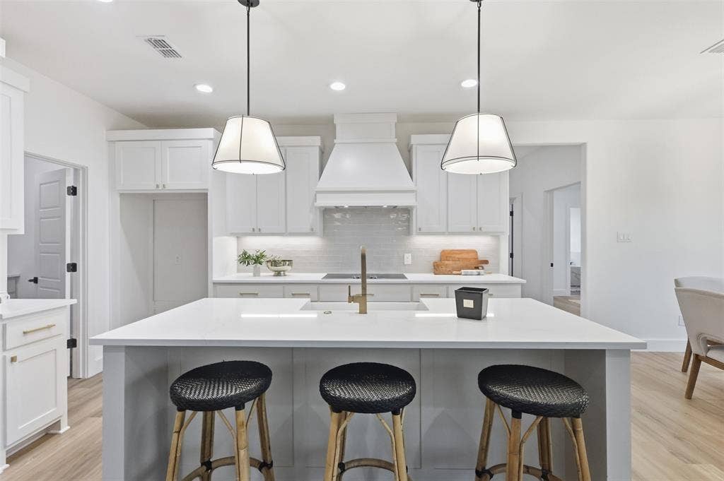 124 Norene Lane, Weatherford, TX 76088 Central kitchen island with a built-in sink and seating