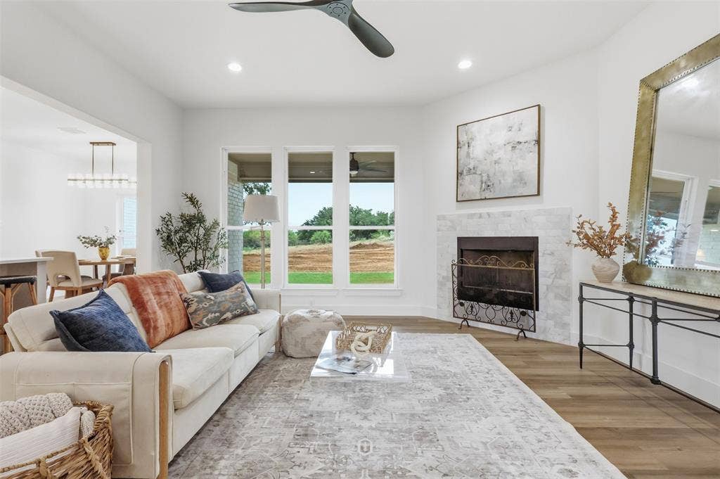 124 Norene Lane, Weatherford, TX 76088 Wood-finish flooring throughout, complemented by recessed lighting and a ceiling fan