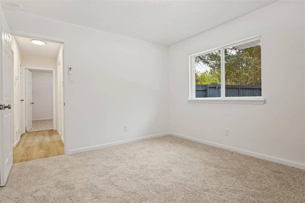 Neutral carpeting and white walls