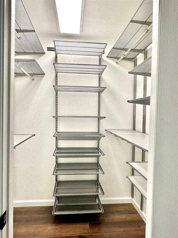 936 Carlsbad Drive, Plano, TX 75023 Primary's walk-in-closet with custom organization
