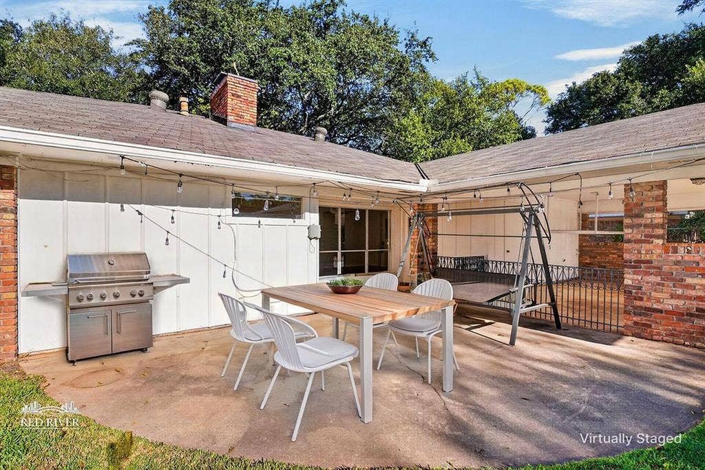 Rear patio overlooking fenced back yard