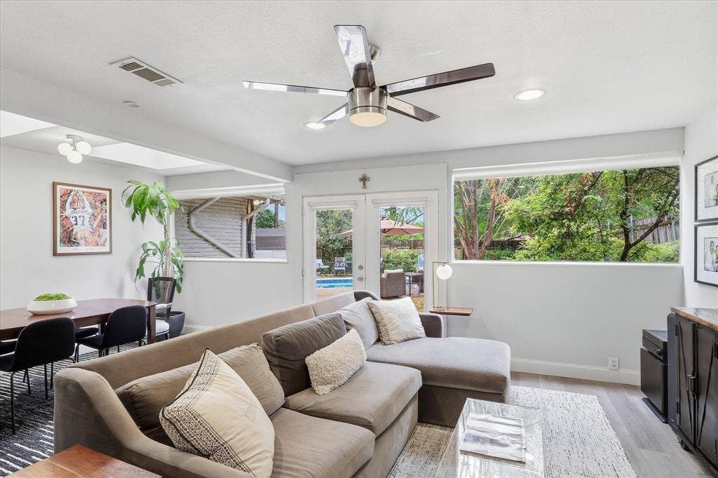 306 W Northgate Drive, Irving, TX 75062 Recessed lighting with a modern ceiling fan, wood-finish flooring, and expansive windows