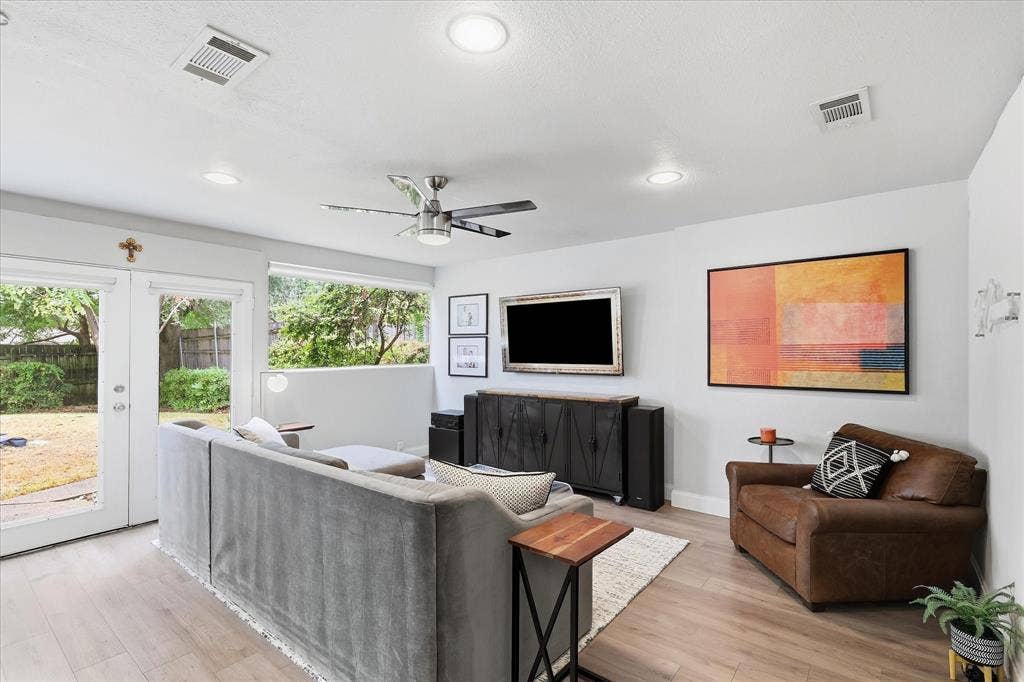306 W Northgate Drive, Irving, TX 75062 Wood-finish flooring throughout, recessed lighting, and a ceiling fan with integrated lighting