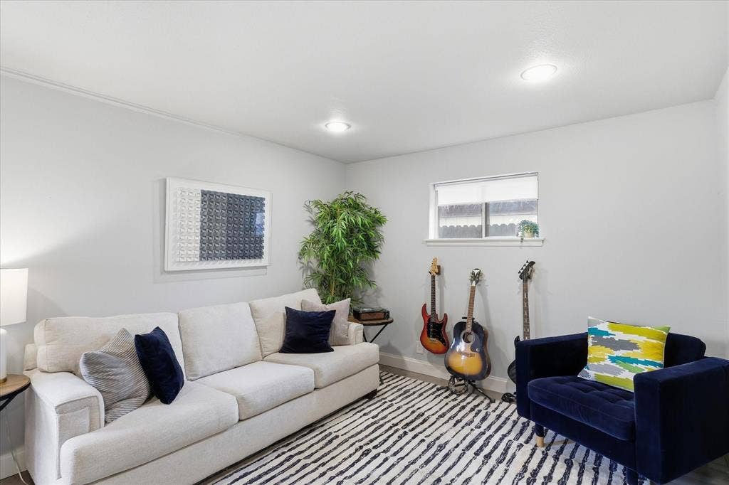 306 W Northgate Drive, Irving, TX 75062 Recessed ceiling lighting, light gray wall finishes, a single-pane window, and faux wood-finish flooring