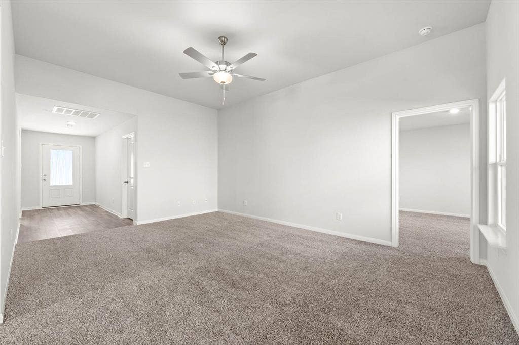 6308 Hyena Hollow Drive, Dallas, TX 75241 Carpeted empty room with ceiling fan