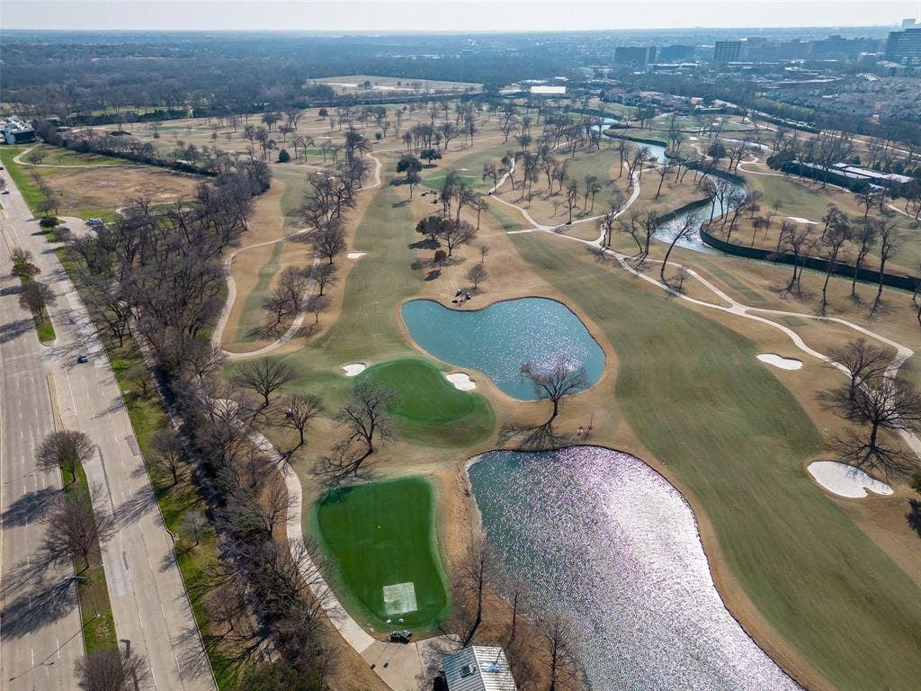 8640 Breakers Point, Dallas, TX 75243 Expansive golf course featuring multiple fairways, water features, sand traps, and mature trees
