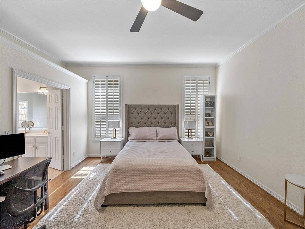 8640 Breakers Point, Dallas, TX 75243 Hardwood-finish flooring, crown molding, and a ceiling fan