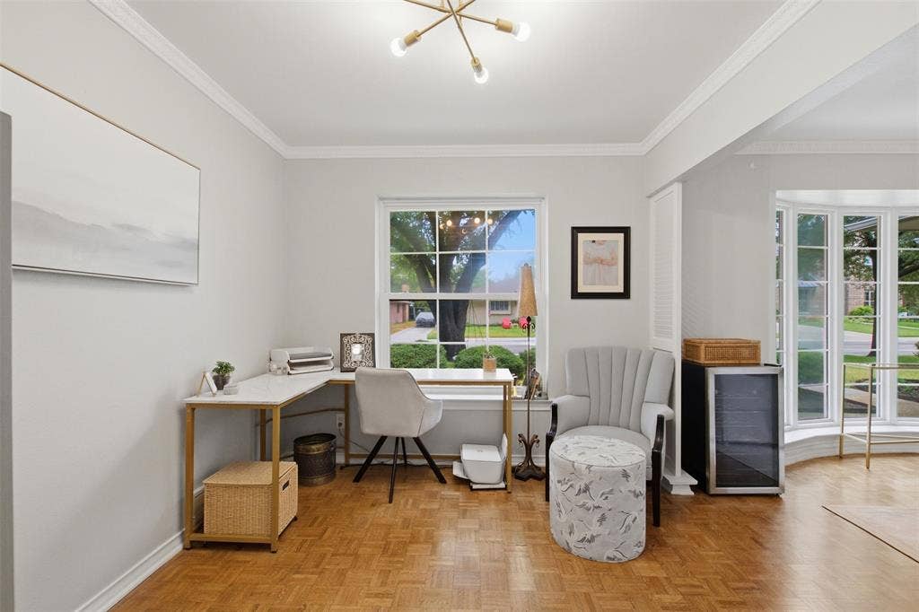 3612 Regent Drive, Dallas, TX 75229 Parquet wood-finish flooring, crown molding, modern ceiling fixture, and a bay window