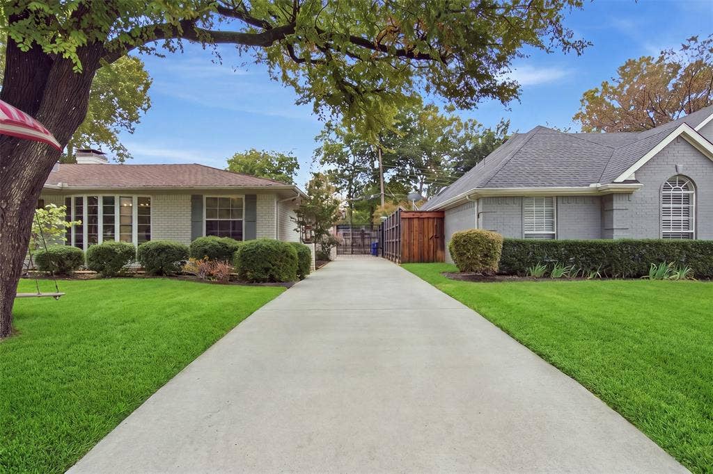3612 Regent Drive, Dallas, TX 75229 Extended concrete driveway providing off-street parking
