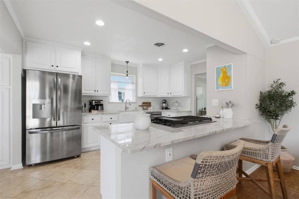 3612 Regent Drive, Dallas, TX 75229 Kitchen featuring white cabinetry, stainless steel appliances, a built-in gas cooktop, stone countertops, and tile flooring