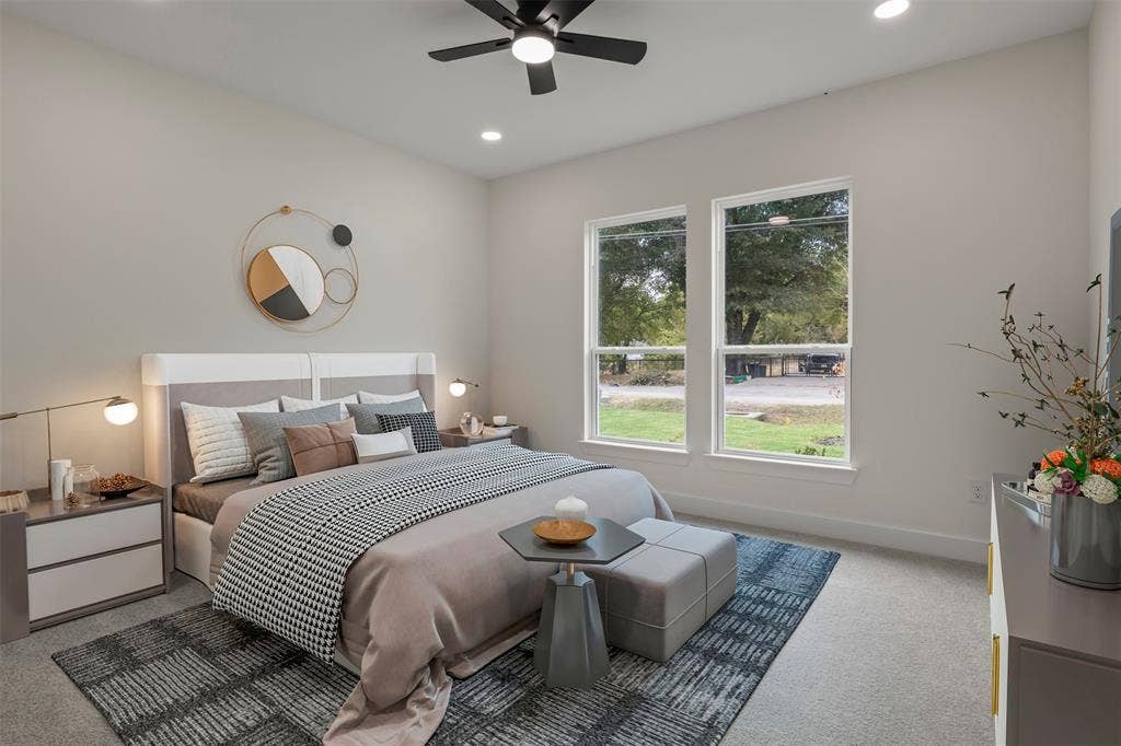 High ceilings with recessed lighting, dual pane windows, and a ceiling fan