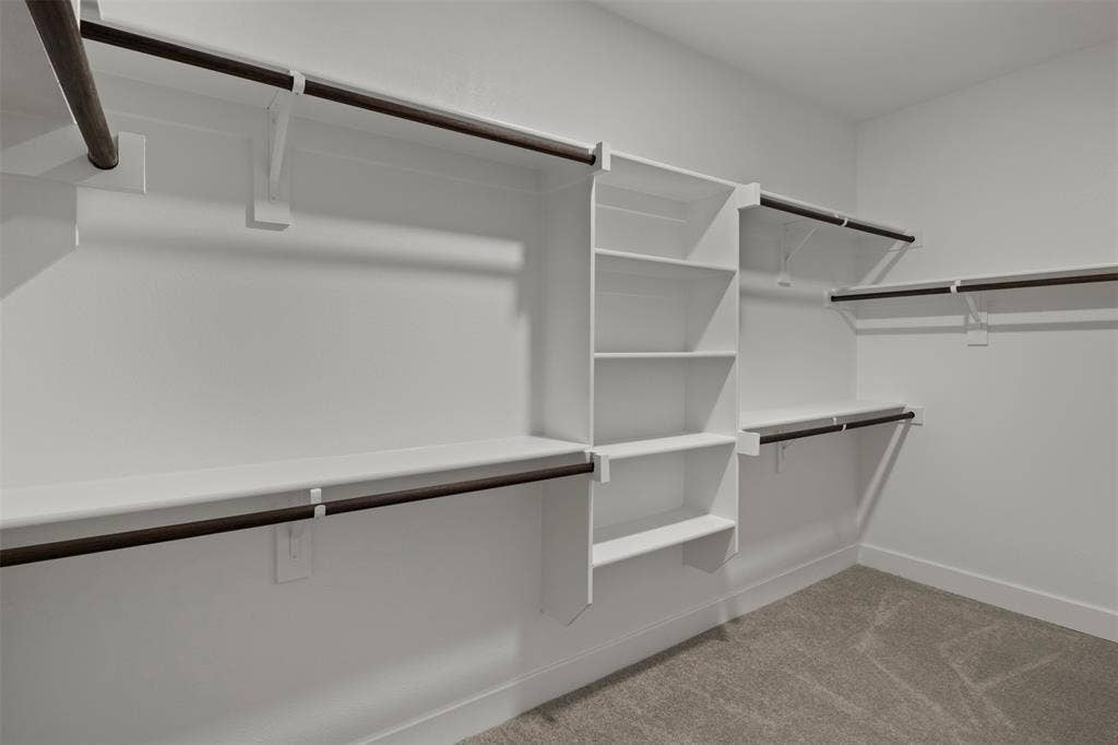 2507 Picadilly Boulevard, Mesquite, TX 75149 Custom closet system featuring multiple shelves and hanging rods