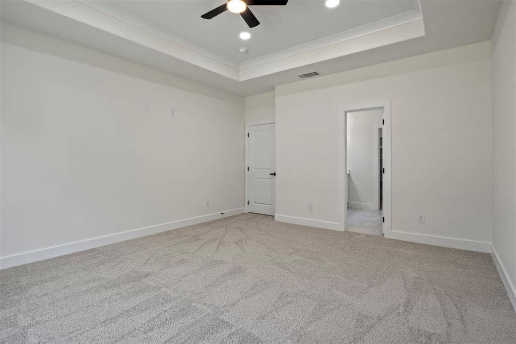 2507 Picadilly Boulevard, Mesquite, TX 75149 Spacious room with tray ceiling, recessed lighting, ceiling fan, carpet flooring, and white trim
