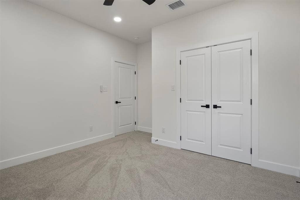 2507 Picadilly Boulevard, Mesquite, TX 75149 Recessed lighting, plush carpet flooring, white trim, flat-panel interior doors, and matte black hardware