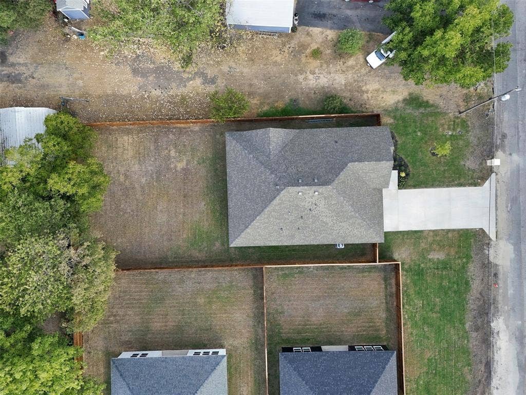 2507 Picadilly Boulevard, Mesquite, TX 75149 New construction residence featuring a gray shingle roof, concrete driveway, and established fencing