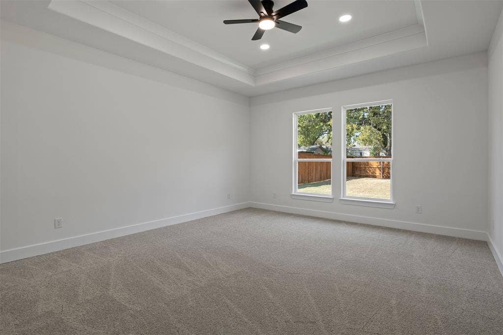2507 Picadilly Boulevard, Mesquite, TX 75149 Spacious room featuring a tray ceiling, recessed lighting, and a ceiling fan