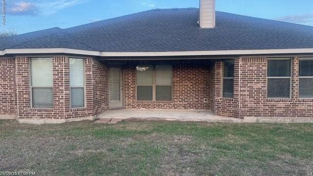 Brick exterior with an asphalt shingle roof