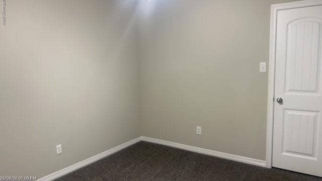 Neutral wall paint, textured carpeting, crisp white trim, and a paneled interior door