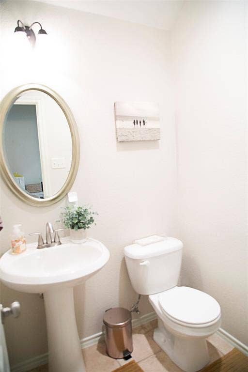 7416 Rolling Hills Drive, Benbrook, TX 76126 Half Bathroom off to the kitchen by the garage.
