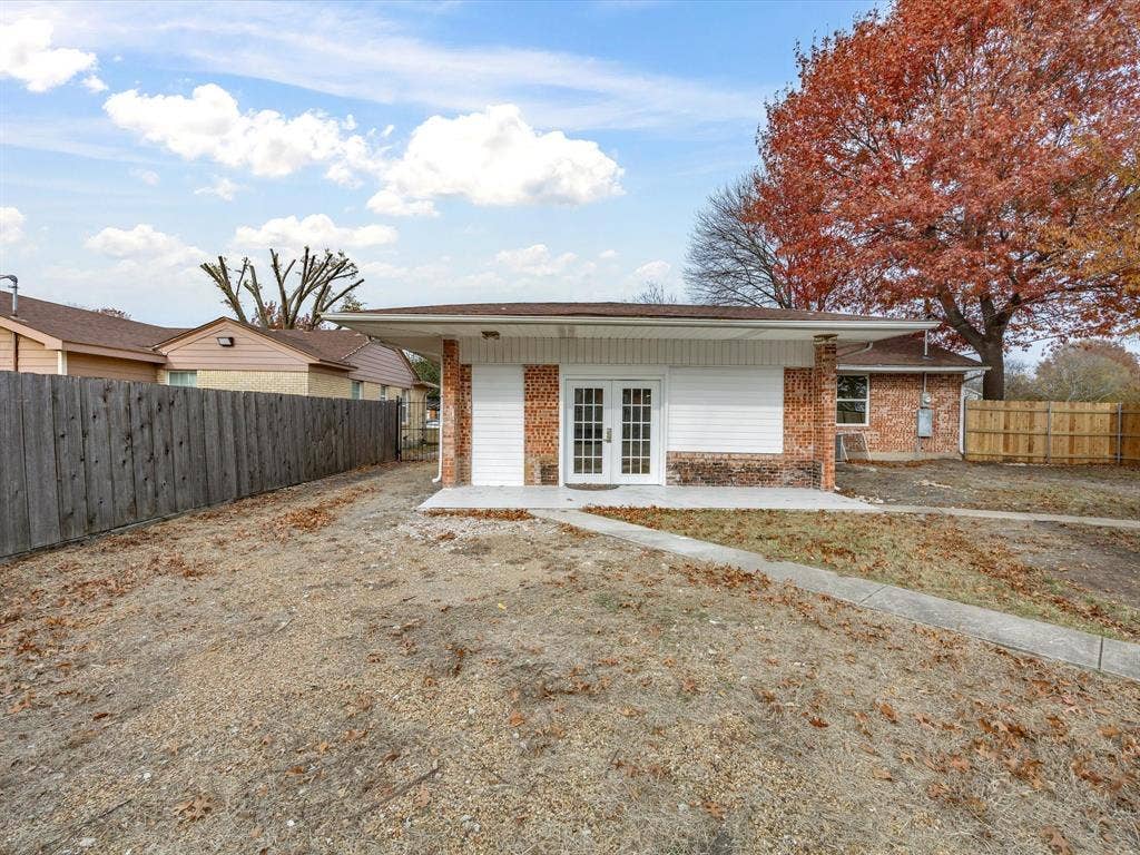10270 Kilkenny Place, Dallas, TX 75228 Exterior featuring white siding, brick accents, and a covered porch