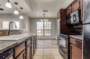 5726 Marvin Loving Drive, #221, Garland, TX 75043 Kitchen featuring brown wood-finish cabinetry, built-in appliances, a dual-basin sink, and granite-look countertops