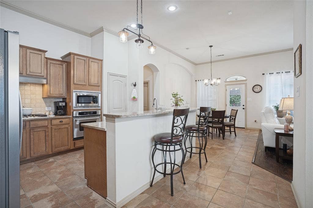 The heart of the home! The open-concept kitchen flows seamlessly into the living area, creating the perfect space for family gatherings, entertaining friends, and making memories together.