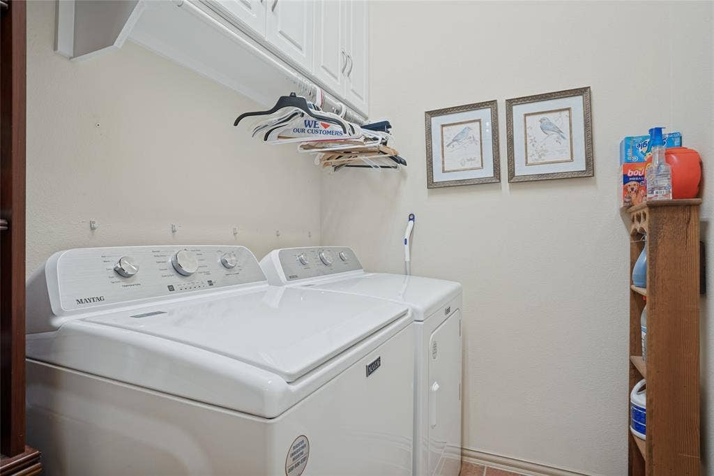 Oversized utility room with plenty of shelving and storage.