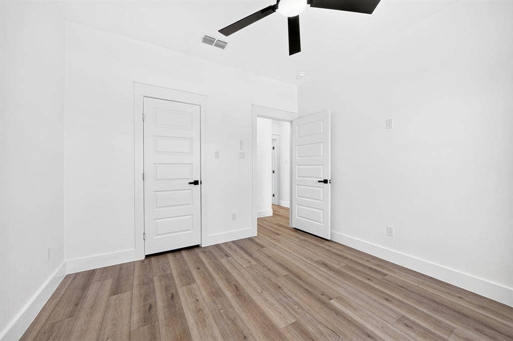 5731 Lewis Court, Athens, TX 75752 Recessed lighting, wood-finish flooring, contemporary ceiling fan, white paneled doors, and modern door hardware