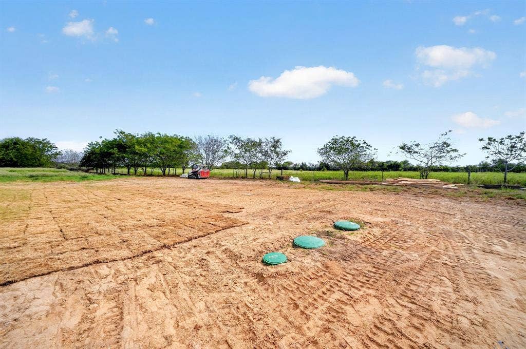 5731 Lewis Court, Athens, TX 75752 Expansive land with partial sod installation and mature trees along the perimeter