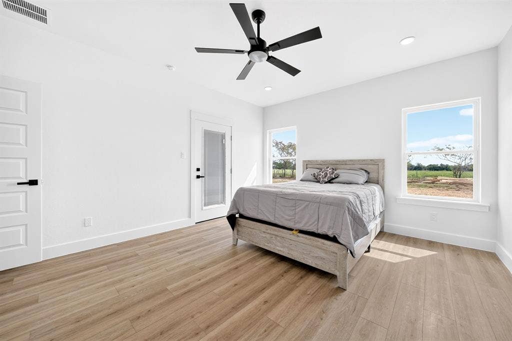 5731 Lewis Court, Athens, TX 75752 Spacious room with wood-finish flooring, recessed lighting, and a contemporary ceiling fan