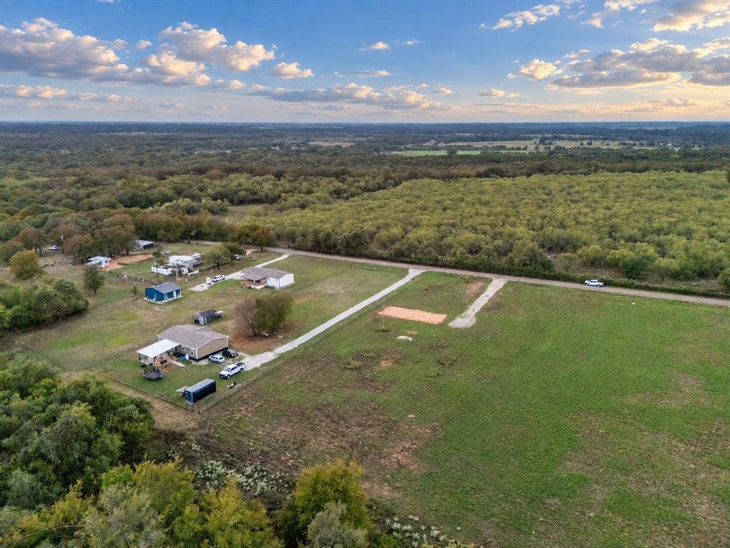 TBD MARY WARE, Waco, TX 76705 Expansive rural landscape featuring multiple clearings, wooded areas, and a visible roadway