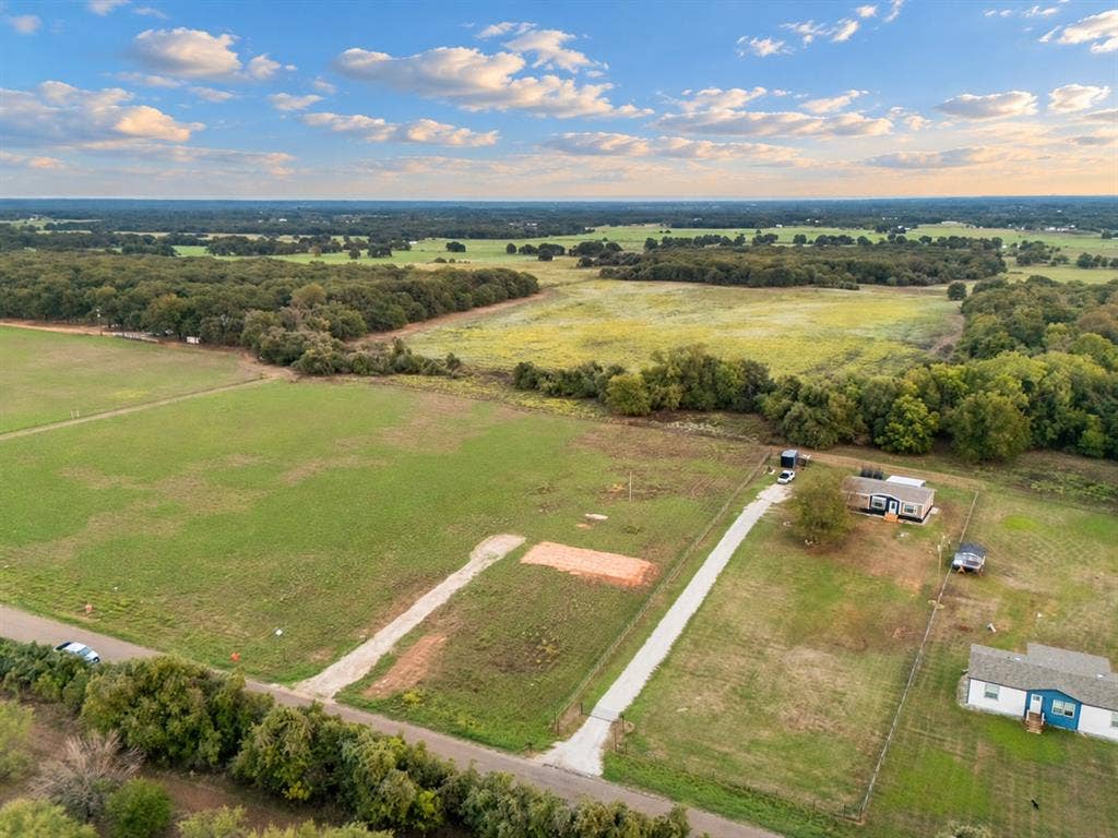 TBD MARY WARE, Waco, TX 76705 Expansive acreage featuring a gravel drive, established fencing, and surrounding mature trees