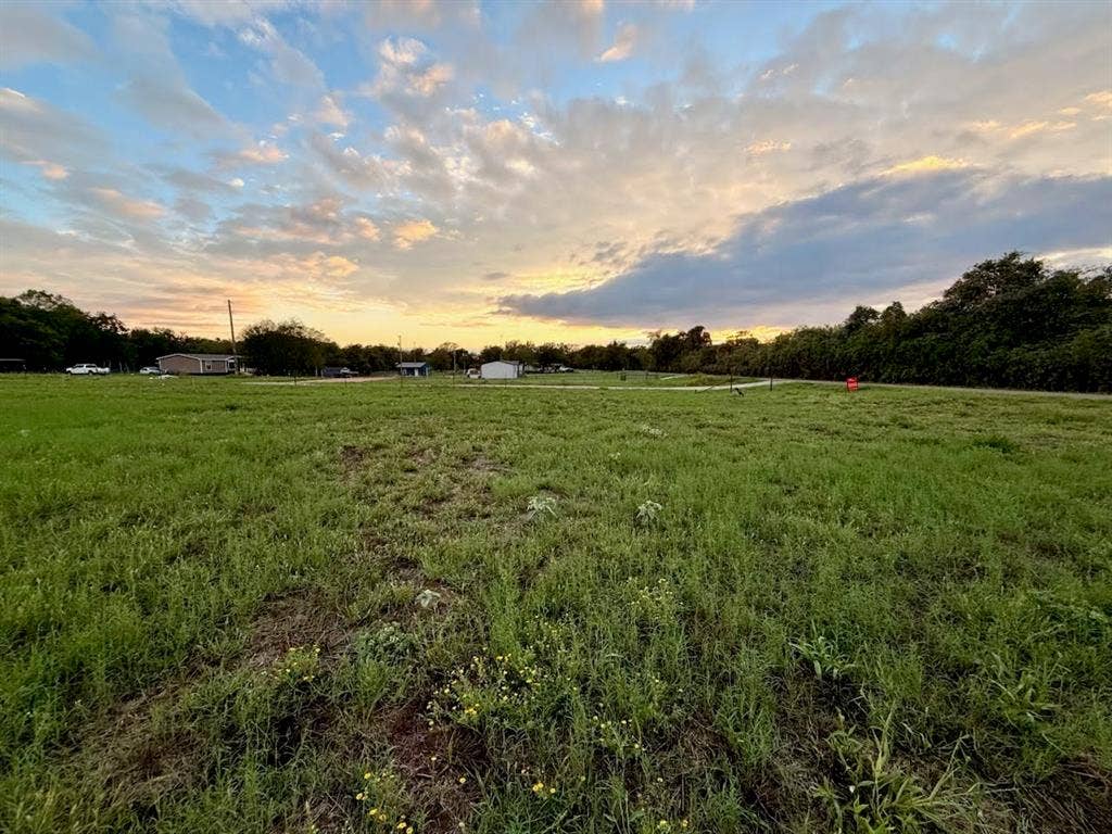 TBD MARY WARE, Waco, TX 76705 Expansive grass field with distant structures and mature trees