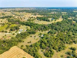6630 Prather Road, Springtown, TX 76082 Expansive rural landscape with multiple residential structures, wooded areas, and open fields