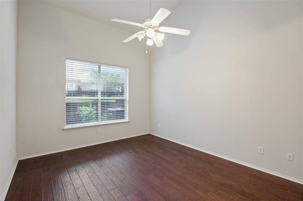 3236 Twist Trail, Plano, TX 75093 Vaulted ceiling, wood-finish flooring, ceiling fan with integrated lighting, and a large window with blinds
