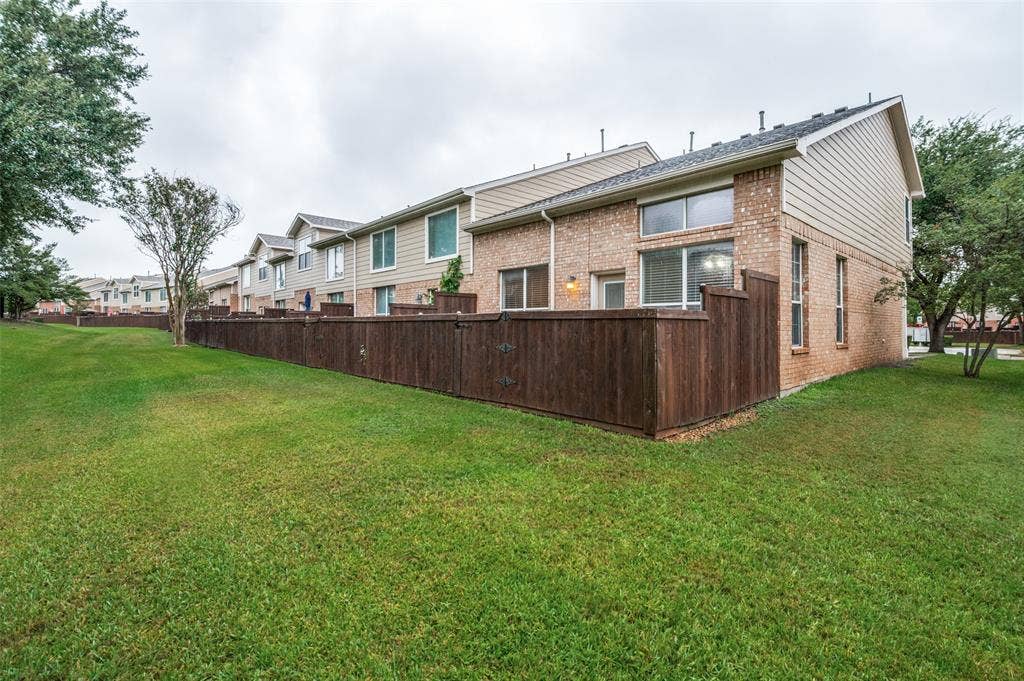 3236 Twist Trail, Plano, TX 75093 Expansive grassy yard with a privacy fence
