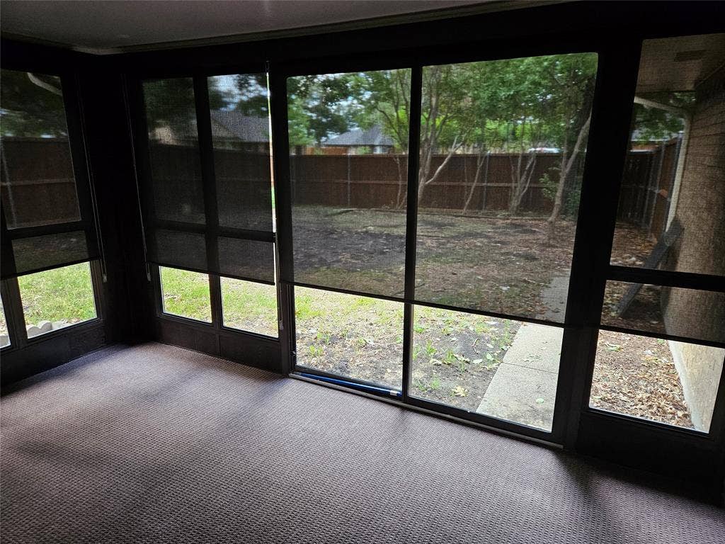 Custom roller shades partially down to give privacy and shade from sun.