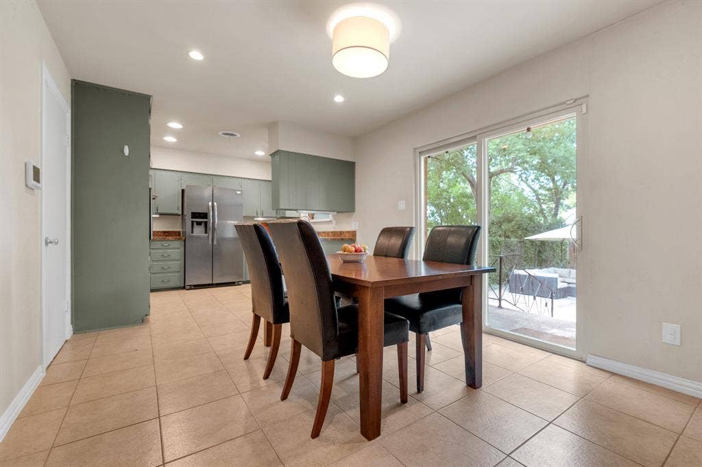 1815 Oates Drive, Dallas, TX 75228 Dining area featuring tile flooring and a contemporary ceiling light fixture
