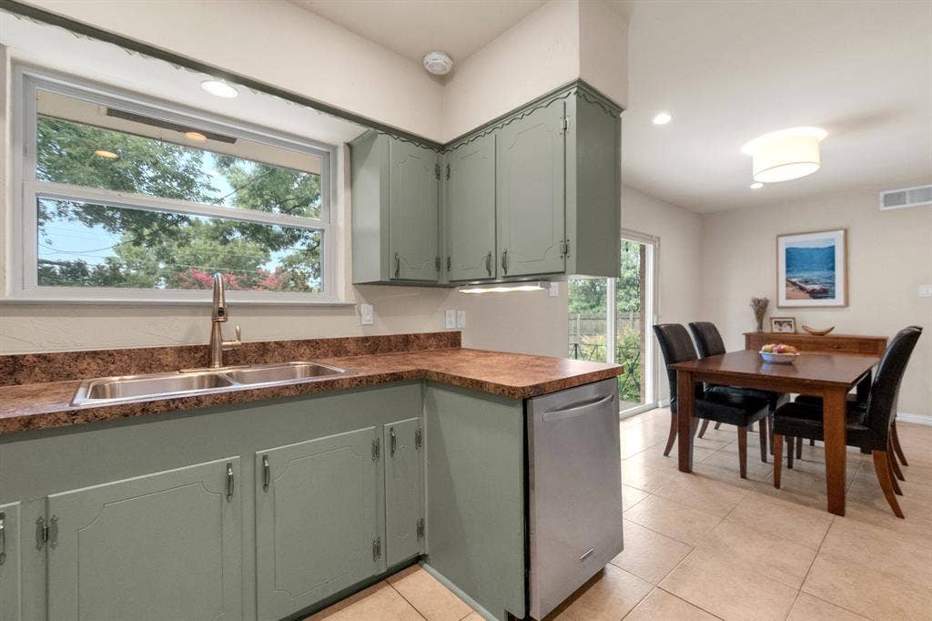 1815 Oates Drive, Dallas, TX 75228 Kitchen with sage green cabinetry and a dual basin stainless steel sink