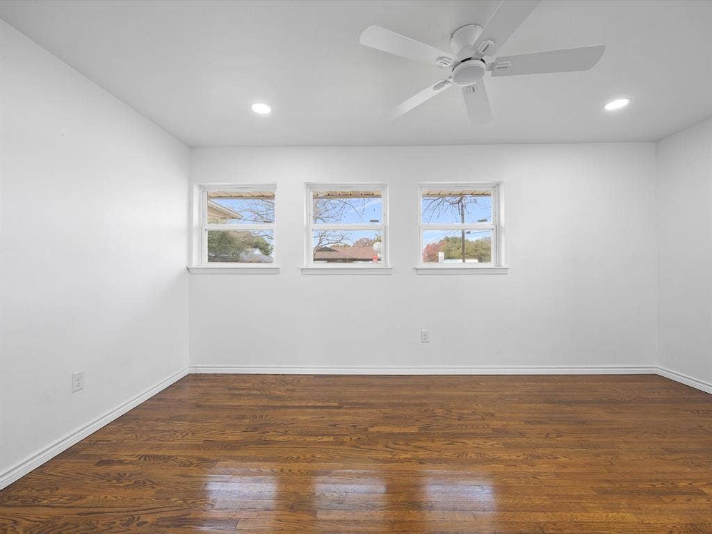 10270 Kilkenny Place, Dallas, TX 75228 Hardwood-finish flooring, three windows with white trim, recessed lighting, and a ceiling fan