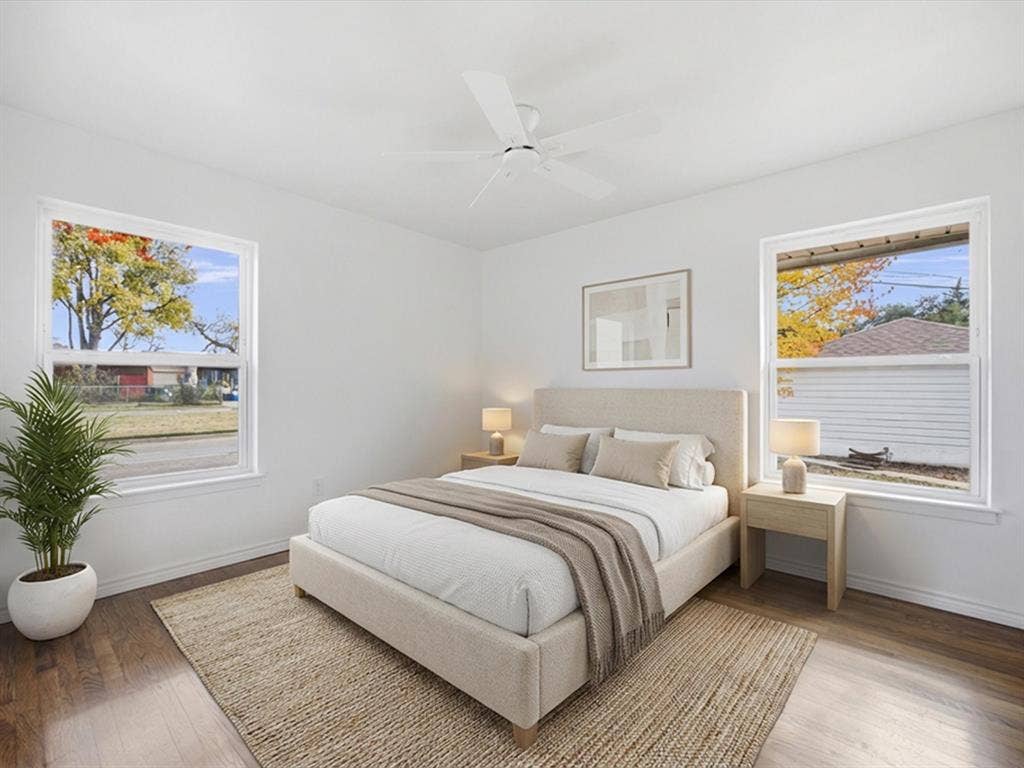 10270 Kilkenny Place, Dallas, TX 75228 Wood-finish flooring, white walls, two double-hung windows, and a ceiling fan