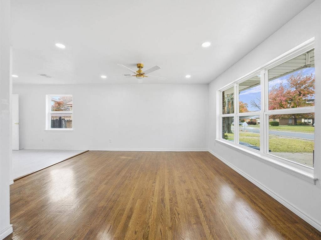 10270 Kilkenny Place, Dallas, TX 75228 Expansive room featuring wood-finish flooring, white walls, multiple windows, recessed lighting, and a ceiling fan